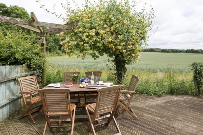 The rear decked terrace has uniterrupted views across the surrounding fields.