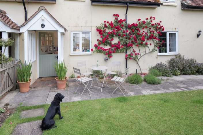 The pretty front garden is fully enclosed so that you can relax with your four-legged friend.