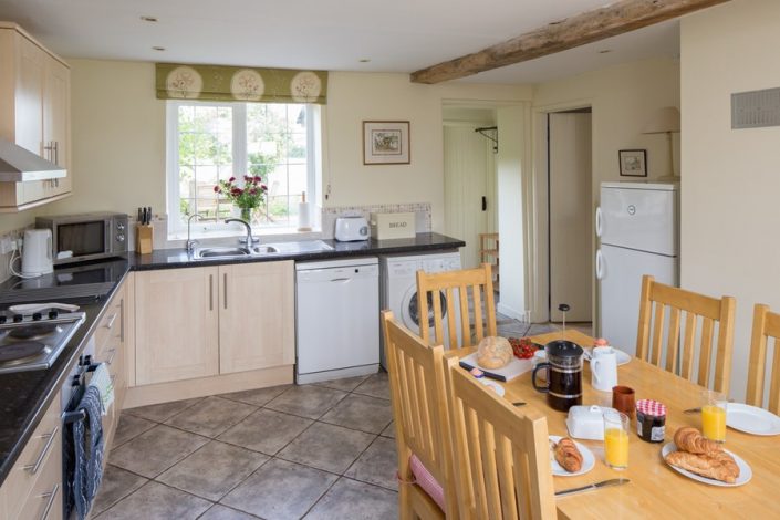 The kitchen is very well-equipped with plenty of space for the dining-area.